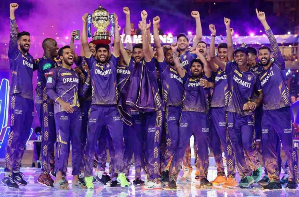Kolkata Knight Riders players celebrating together after winning IPL match on the field